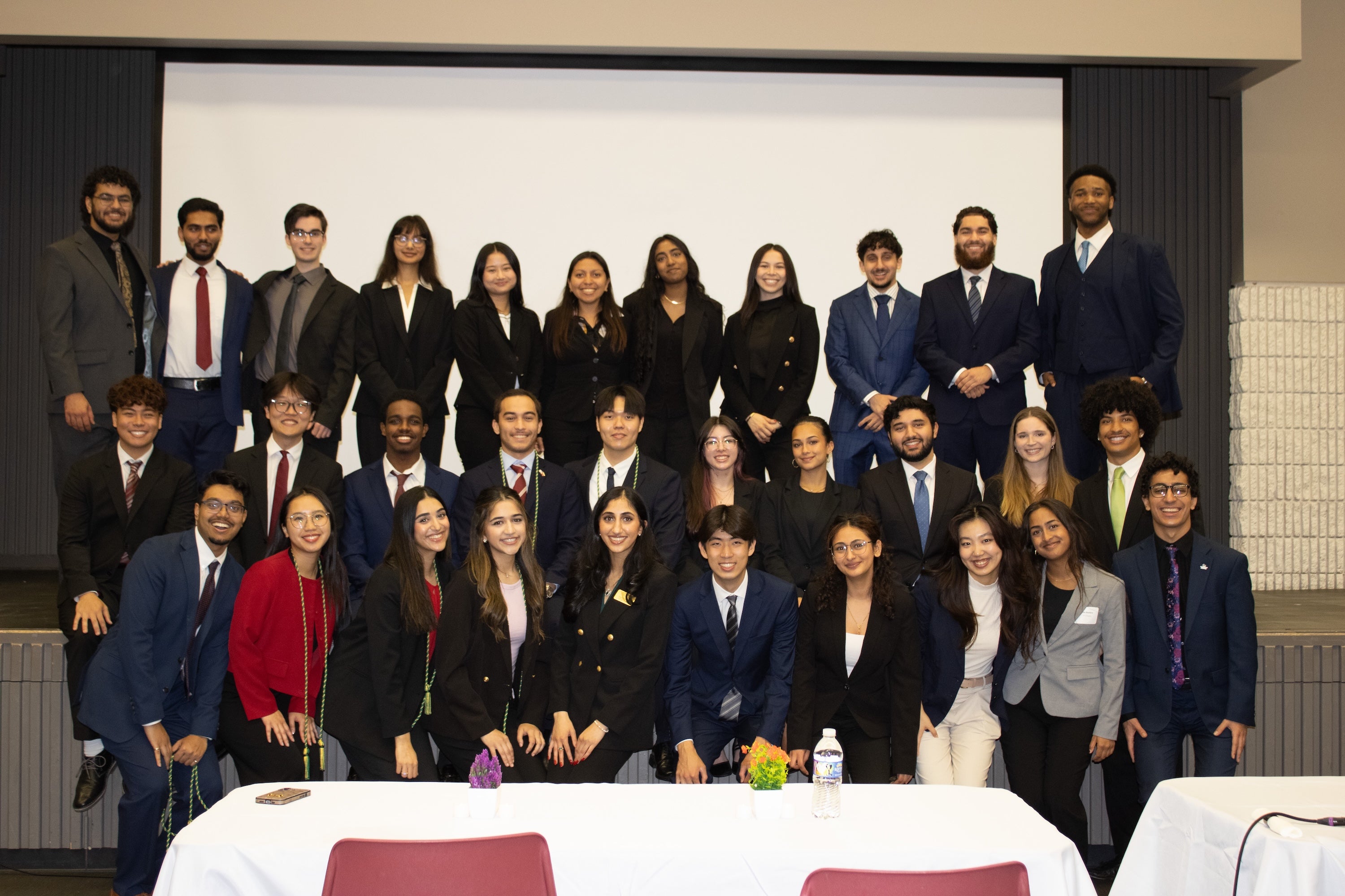 Mason Consulting Group (executive board and senior advisors in first row, consultants in back two rows). Photo courtesy of Mason Consulting Group.