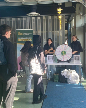Students spinning the wheel to win Costello merchandise.